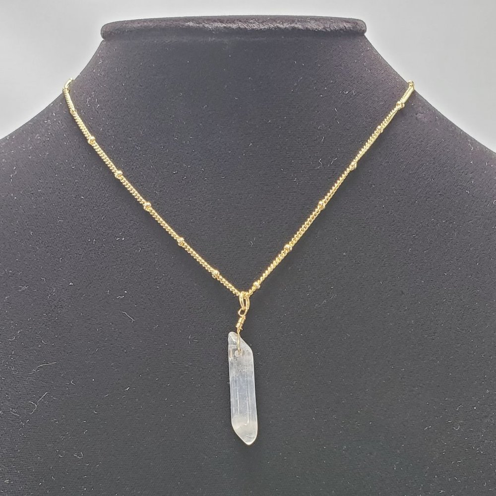 Charming Charlie crystal quartz point, gold chain necklace